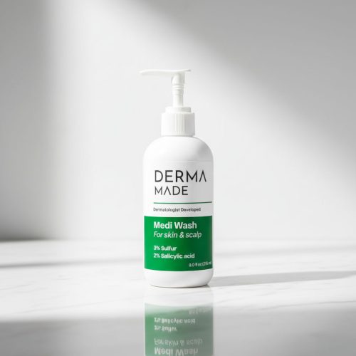 Derma Made Medi Wash on Marble Surface Derma Made Medi Wash bottle on a white marble counter with soft lighting, highlighting the sulfur and salicylic acid cleanser design.