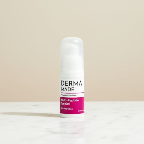 Derma Made Multi-Peptide Eye Gel – Anti-Aging Eye Treatment with 10% Peptides Derma Made Multi-Peptide Eye Gel bottle on a white marble counter with a soft beige background. The 3-inch eye cream product is photographed in a clean, minimalist setting with natural daylight.