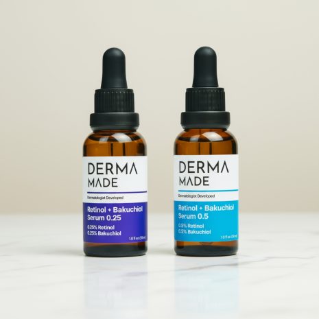 Derma Made Retinol + Bakuchiol Serum 0.25 and 0.5 Skincare Lifestyle image of Derma Made Retinol + Bakuchiol Serum 0.25 and 0.5 bottles on a marble surface, promoting anti-aging skincare for smoother, brighter skin