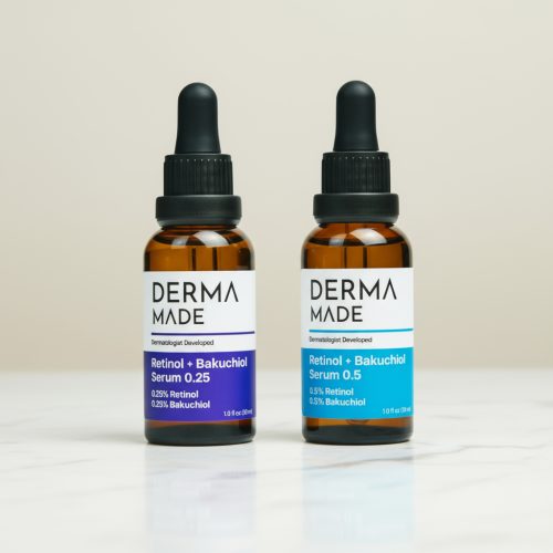 Lifestyle image of Derma Made Retinol + Bakuchiol Serum 0.25 and 0.5 bottles on a marble surface, promoting anti-aging skincare for smoother, brighter skin