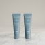 High-quality product photo of Face Reality Acne Med 2.5% and 5% Benzoyl Peroxide acne treatments standing side by side on a marble surface. Dermatologist-developed formulas designed to clear acne and prevent breakouts.