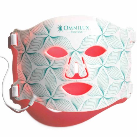 Omnilux Contour Face LED Mask emitting red light for anti-aging and skin rejuvenation